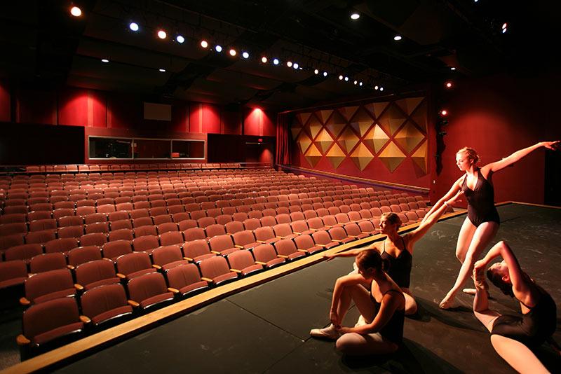 Photo of dancers on stage of the Swisher Theatre