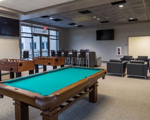 Recreation Area with game tables, lounge chairs and video screens